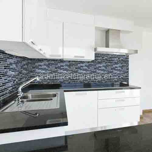 Black kitchen mosaic backsplash