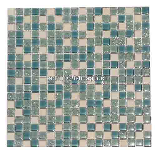 Tiffany blue crackle glass and white stone mosaic tile over cooktop