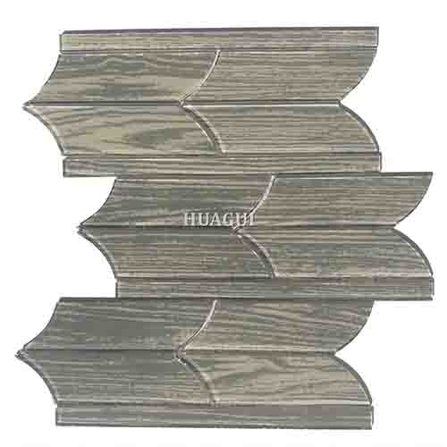 Polished tile of irregular grey glass mosaic backsplash